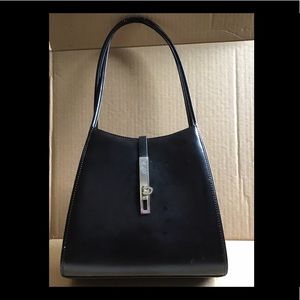 Black patent leather bag.